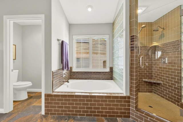 bathroom with shower with separate bathtub and toilet