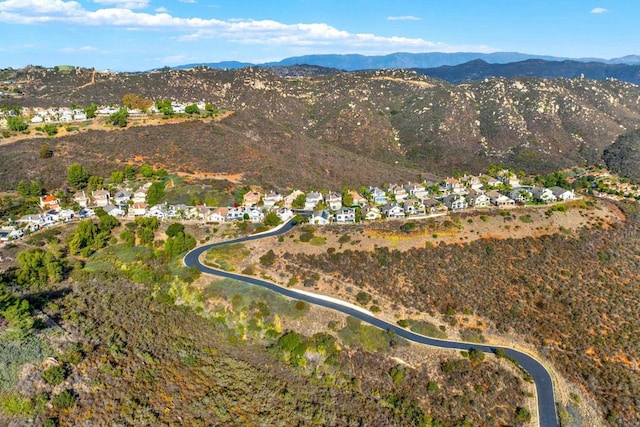 birds eye view of property featuring a mountain view