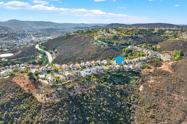 birds eye view of property featuring a mountain view