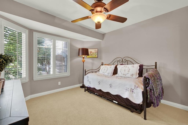 bedroom with light carpet and ceiling fan