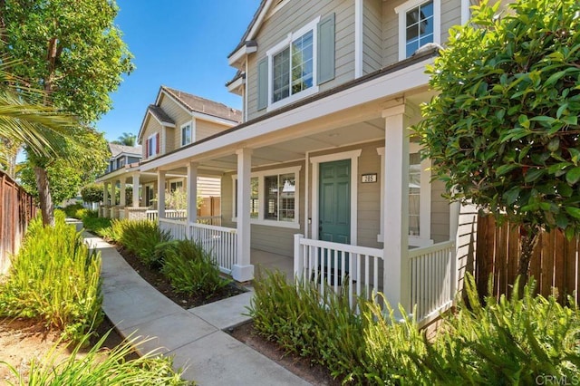 doorway to property with covered porch