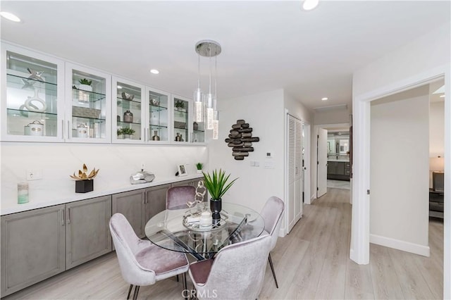 dining area with light wood-type flooring