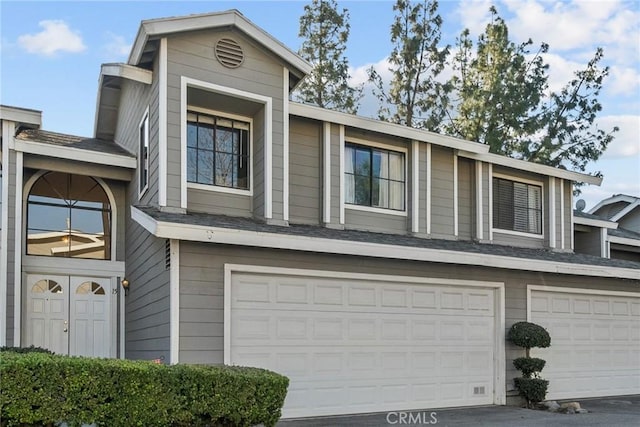 view of front of property with a garage