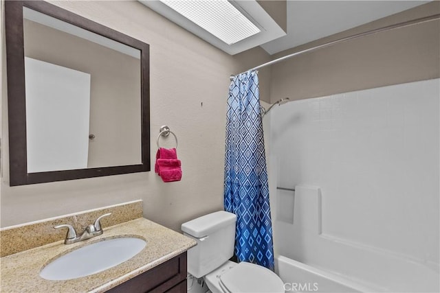 full bathroom featuring toilet, vanity, and shower / bathtub combination with curtain