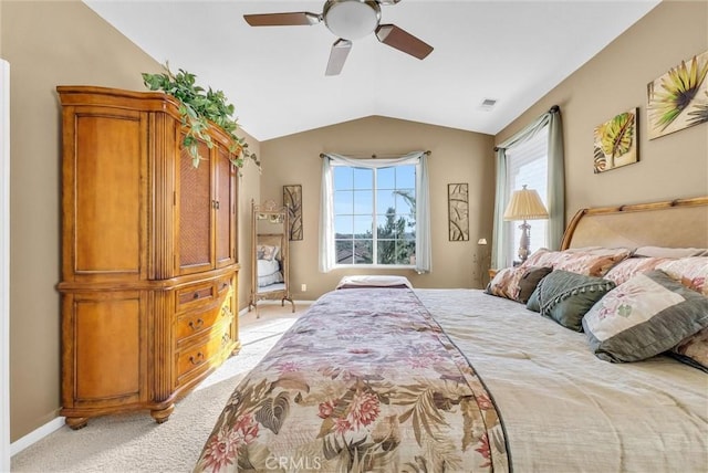 carpeted bedroom with ceiling fan and lofted ceiling