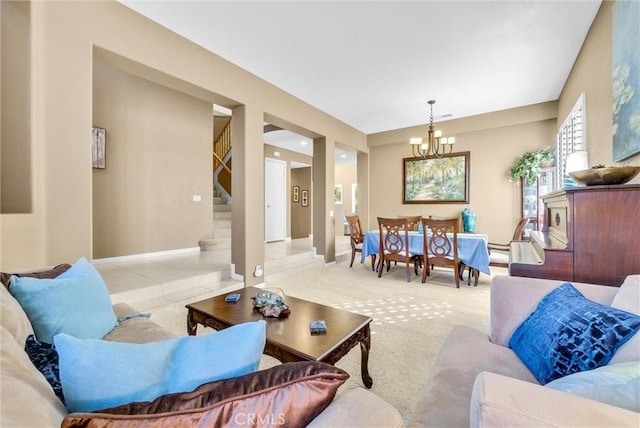 carpeted living room featuring a notable chandelier