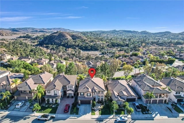 birds eye view of property featuring a mountain view