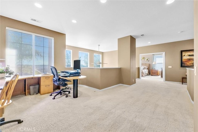 office space with light colored carpet