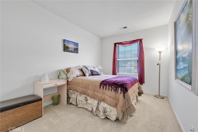 bedroom with light carpet