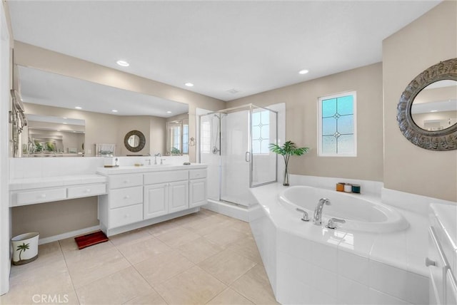 bathroom featuring independent shower and bath, tile patterned flooring, and vanity