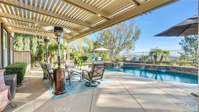 view of patio / terrace featuring pool water feature, a pergola, and a fenced in pool