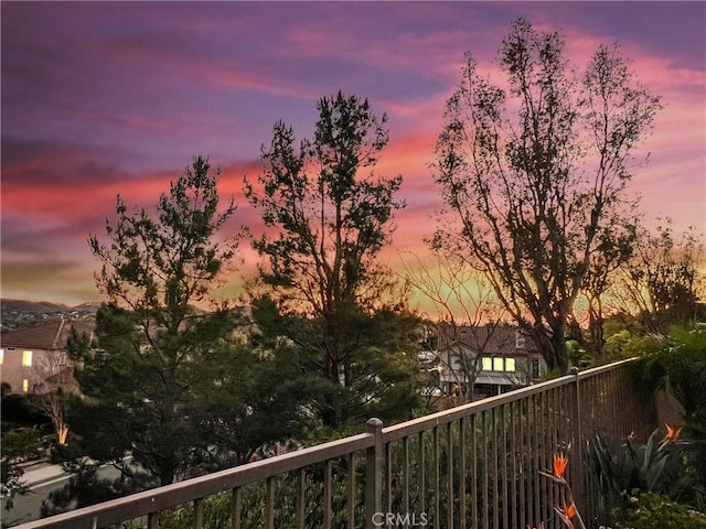 view of balcony at dusk