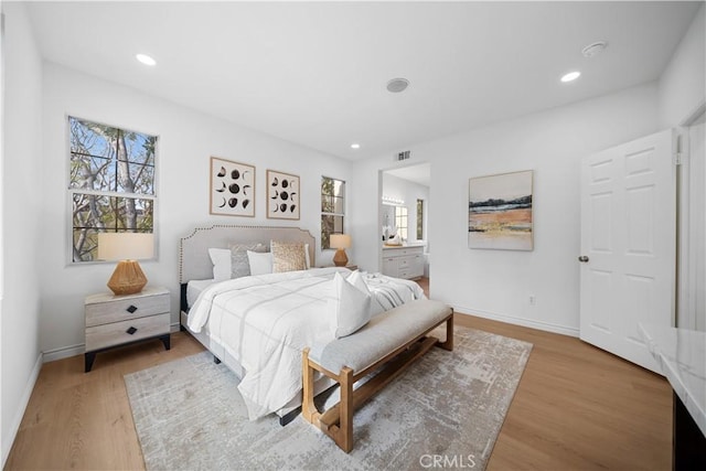 bedroom with hardwood / wood-style flooring