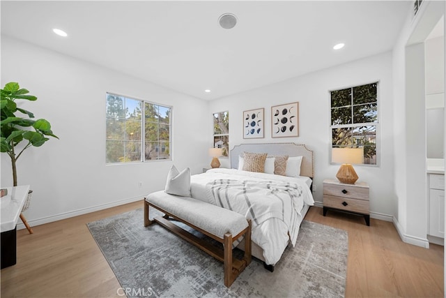 bedroom with light hardwood / wood-style flooring