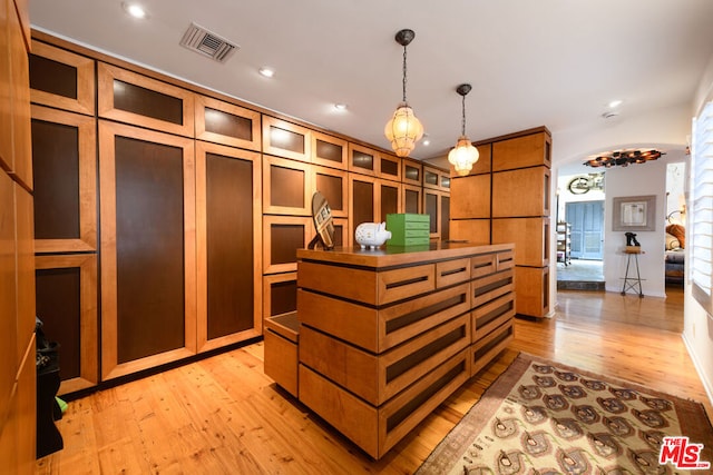 walk in closet featuring light wood-type flooring