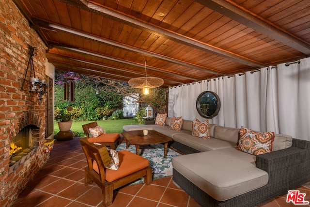 view of patio featuring an outdoor living space with a fireplace