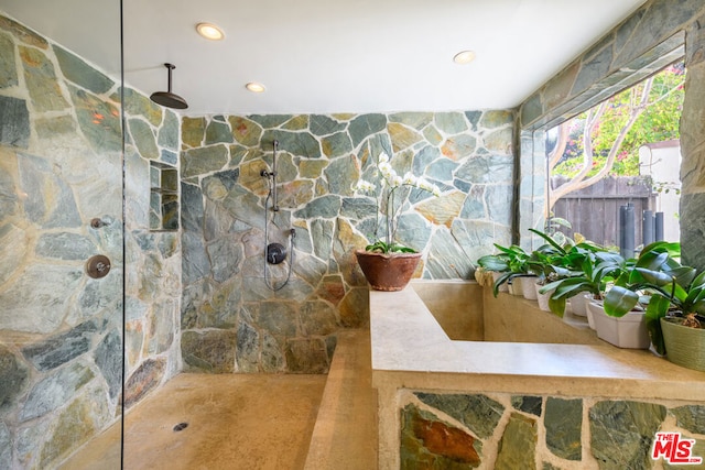 bathroom featuring walk in shower