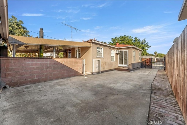 rear view of property featuring a patio area