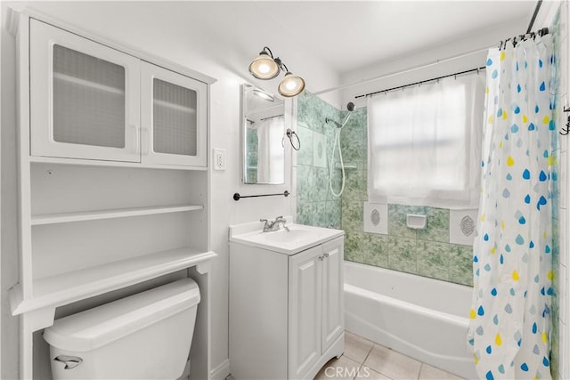 full bathroom featuring shower / bath combo with shower curtain, toilet, vanity, and tile patterned flooring