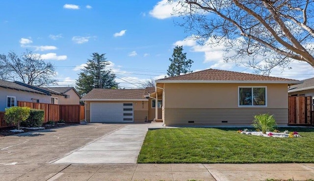 ranch-style home featuring a garage and a front yard