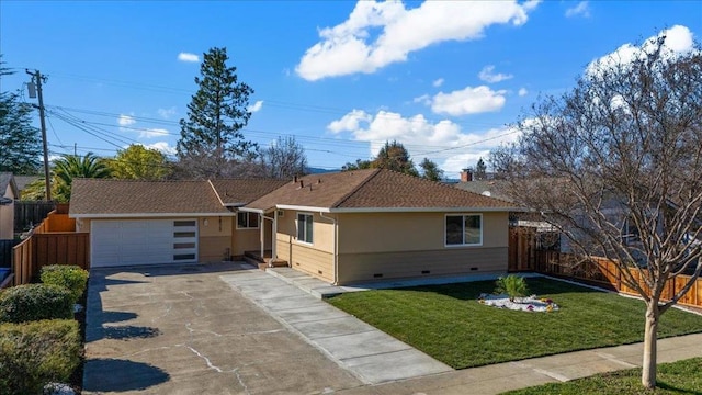 single story home featuring a garage and a front yard