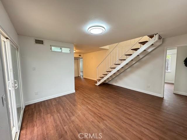 basement featuring dark hardwood / wood-style flooring