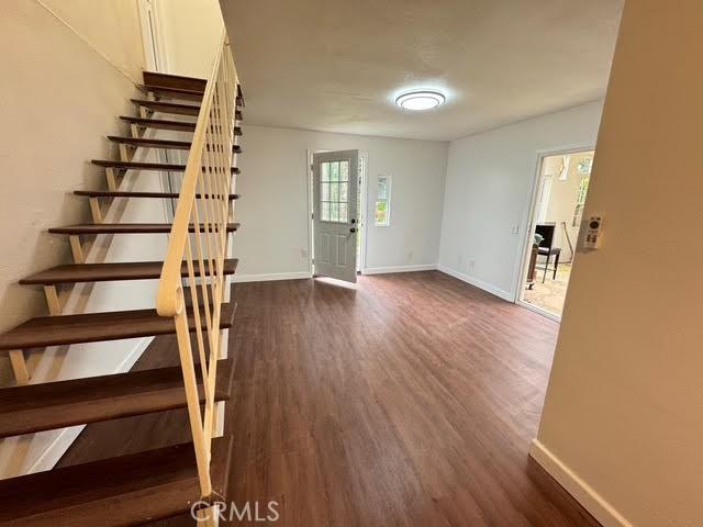 foyer with dark hardwood / wood-style flooring