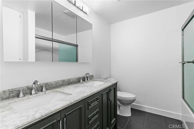 full bathroom with toilet, combined bath / shower with glass door, tile patterned floors, and vanity