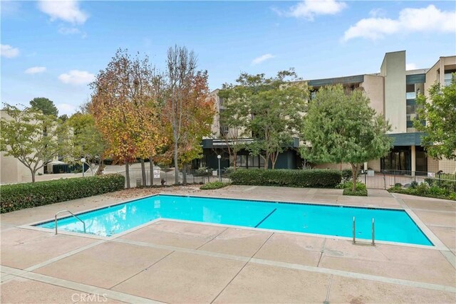 view of swimming pool with a patio