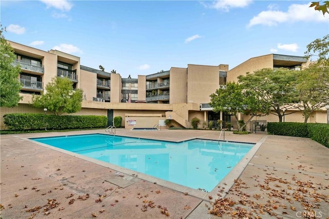 view of pool featuring a patio