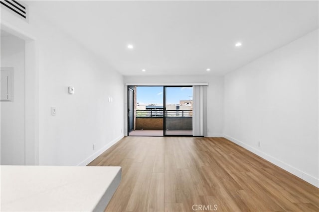 unfurnished living room with light wood-type flooring