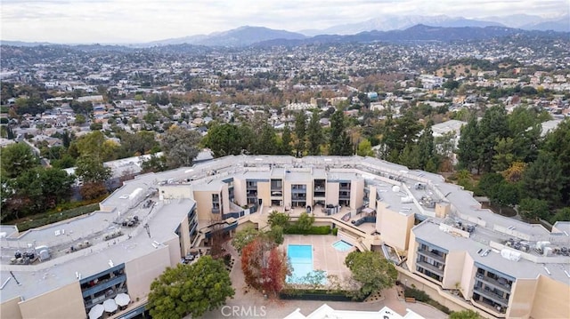 birds eye view of property featuring a mountain view