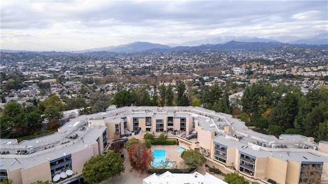 birds eye view of property featuring a mountain view