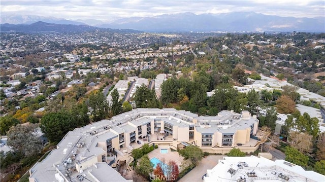 birds eye view of property with a mountain view