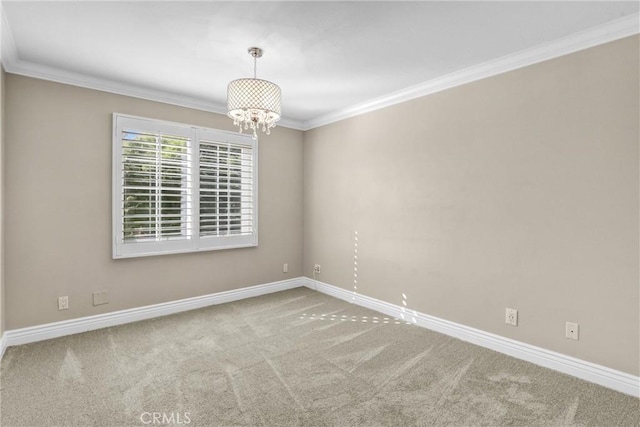 empty room featuring baseboards, carpet, an inviting chandelier, and crown molding