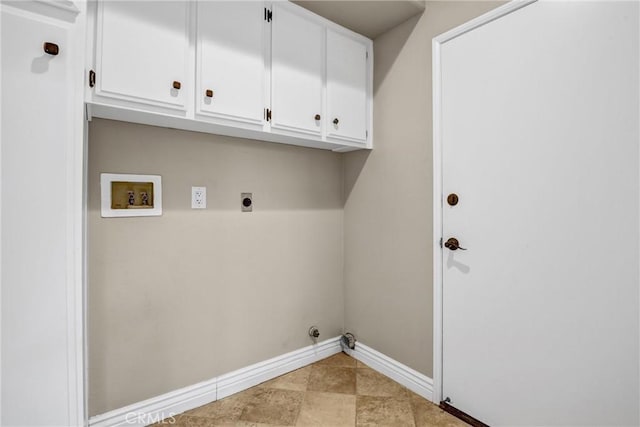 laundry room featuring cabinet space, hookup for a washing machine, electric dryer hookup, and baseboards