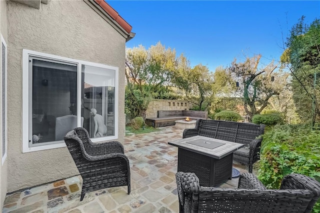 view of patio featuring an outdoor living space and fence