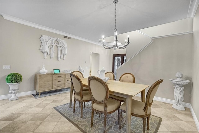 dining room with visible vents, baseboards, and crown molding