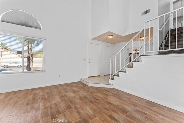 foyer featuring a towering ceiling