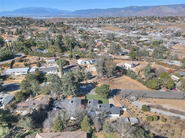 birds eye view of property with a mountain view