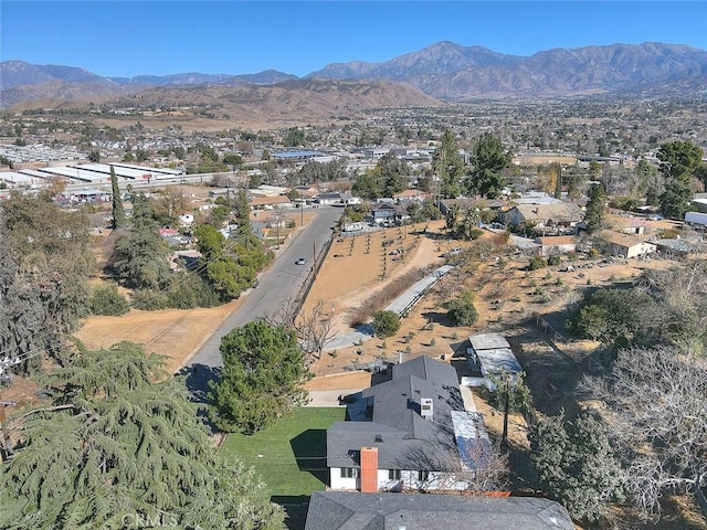 birds eye view of property with a mountain view