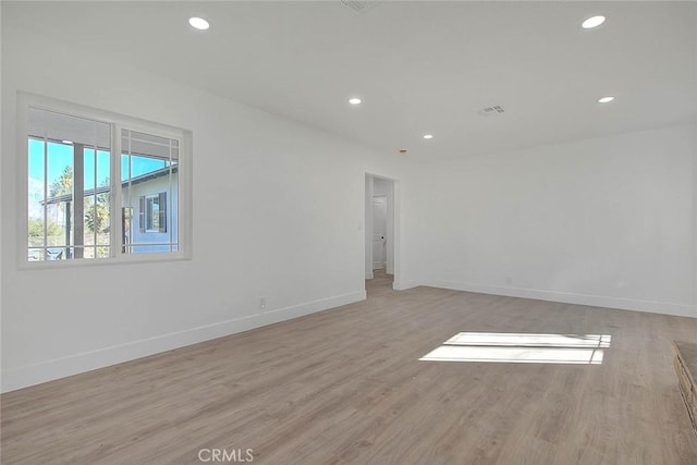 unfurnished room featuring light hardwood / wood-style floors