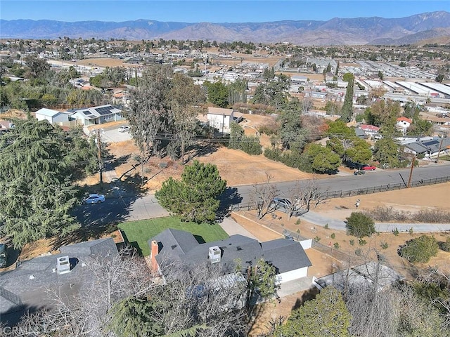 birds eye view of property featuring a mountain view