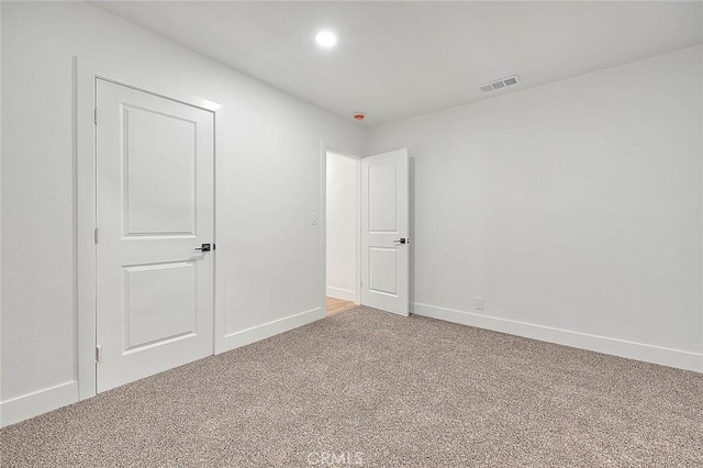 unfurnished room with carpet floors