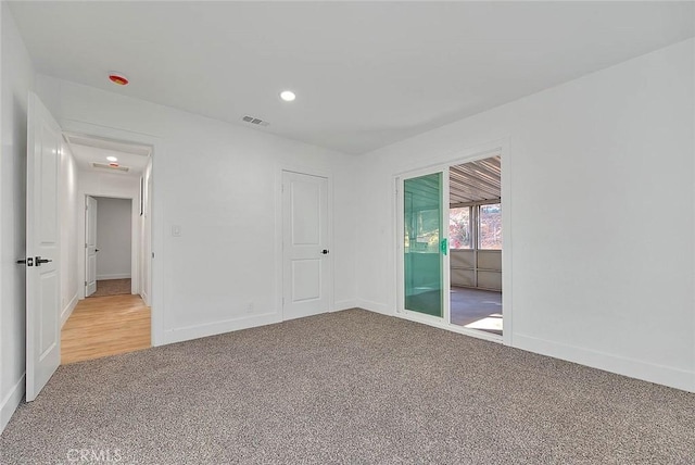 empty room featuring carpet flooring