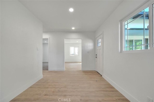 hall with light wood-type flooring