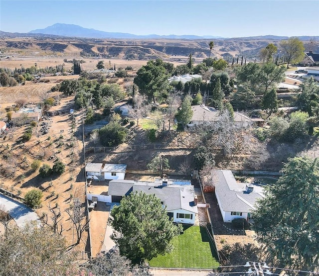 birds eye view of property with a mountain view