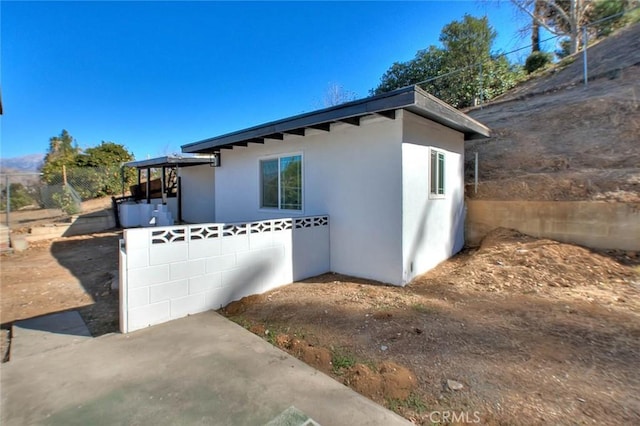 view of home's exterior featuring a patio area