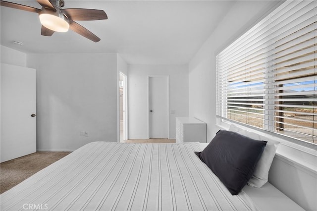 bedroom with light carpet and ceiling fan