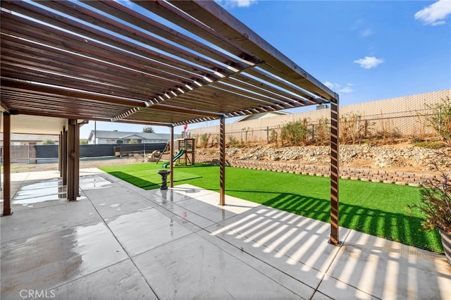 view of patio / terrace featuring a pergola and a playground